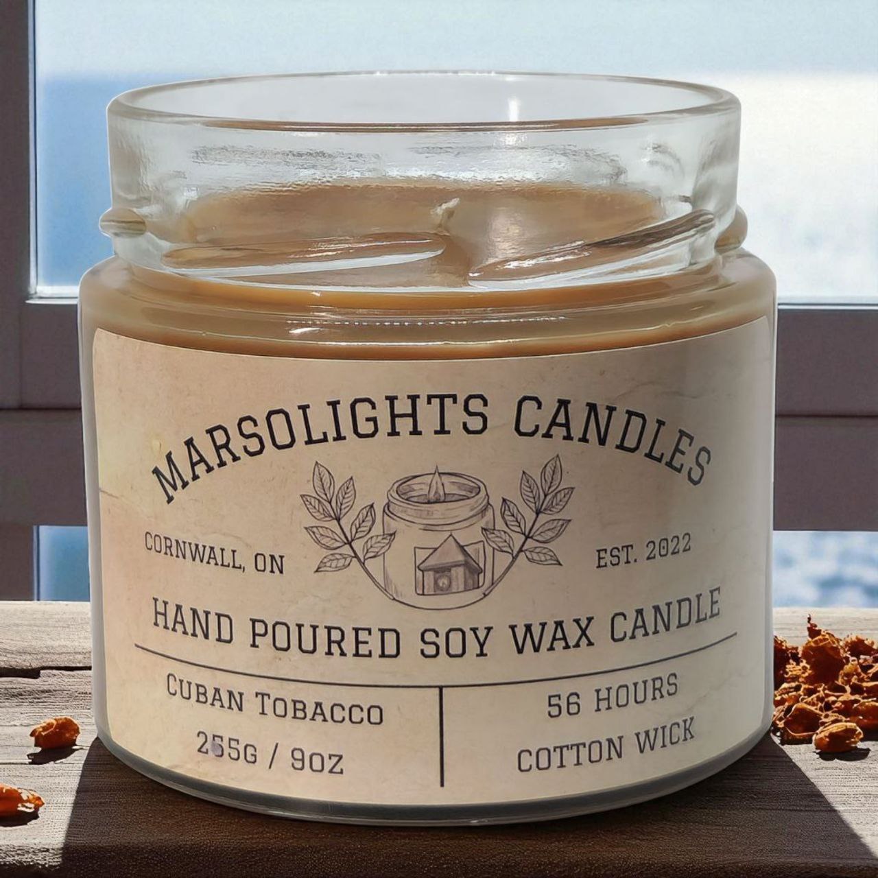 Marsolights Candles jar with label on a wooden surface.
Candle Size: 225 grams or 9 ounces
Burn time: 56 hours
Wick Type: Cotton
Scent: Cuban Tobacco
Made in Ontario Canada
