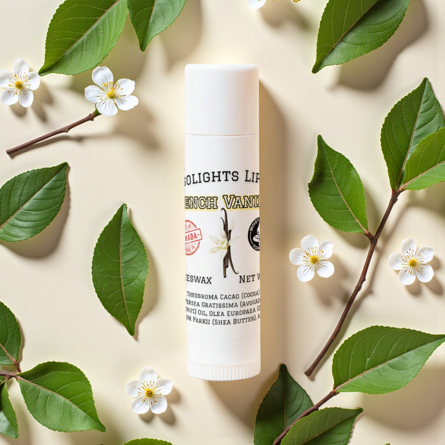 French Vanilla Lip balm tube with green leaves and flowers on a beige background