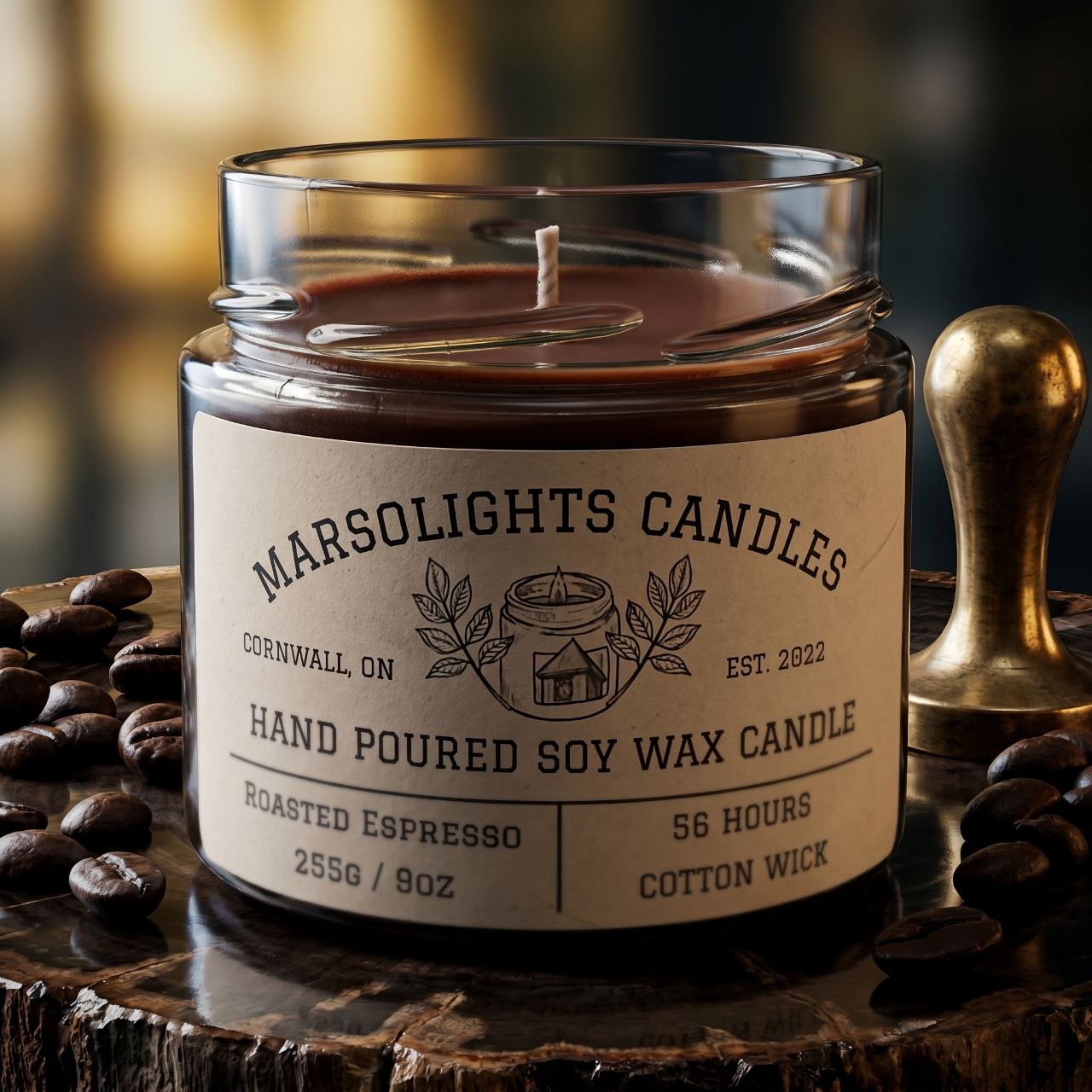 A clear glass soy wax candle jar with a label that reads 'Marsolights Candles, Hand Poured Soy Wax Candle, Roasted Espresso, 255g/9oz, 56 hours'. The jar is placed on a wooden surface with scattered coffee beans around it.