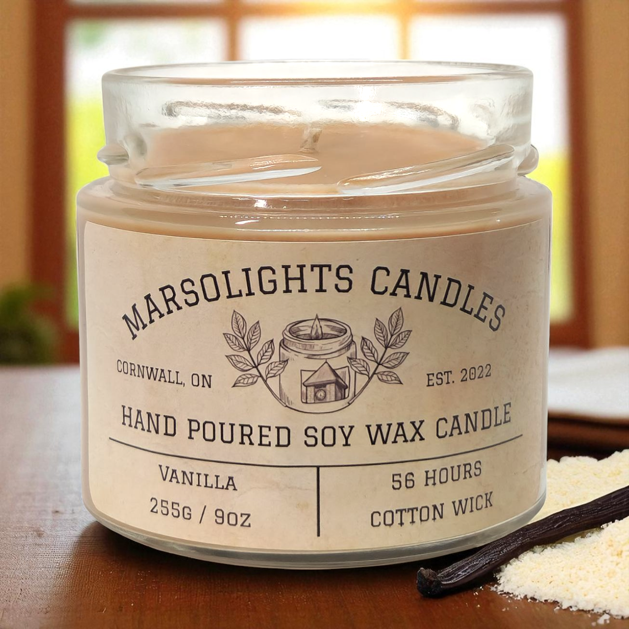 Vanilla candle on a wooden surface with a blurred background and vanilla crunch crystals.
Fragrance Notes:
Top: Coconut, Vanilla Crunch
Mid: Cinnamon, Honeyed Soft Butter
Base: Cassia Root, Vanilla Sugar, Tonka Bean
Size: 255 grams or 9 ounces
Burn time: 56 Hours
Paraben Free