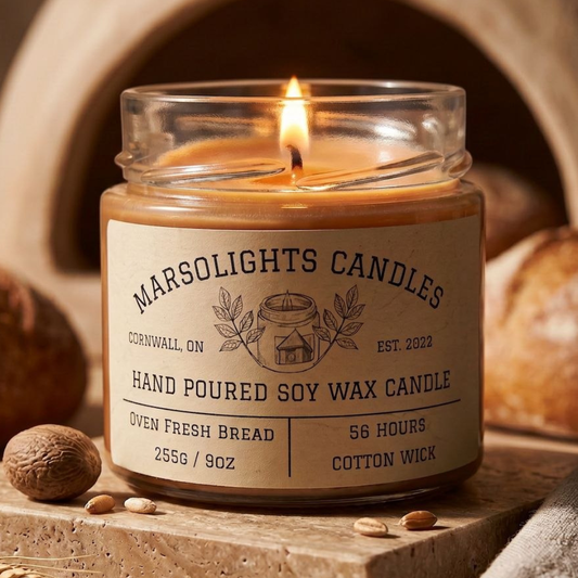 Oven Fresh Bread Candle styled on a stone surface with bread and nut props in a warm rustic setting.
Size: 9 ounces or 255 grams
Scent Profile: Dough, Seeds, Butter and Baked Bread Accord
Burn time: 56 hours Estimated burn time
Wick Type: Cotton
Made in Canada