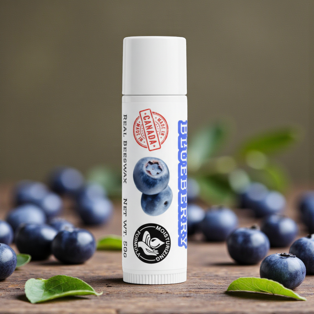 Lip balm with blueberry design on a wooden surface with blueberries