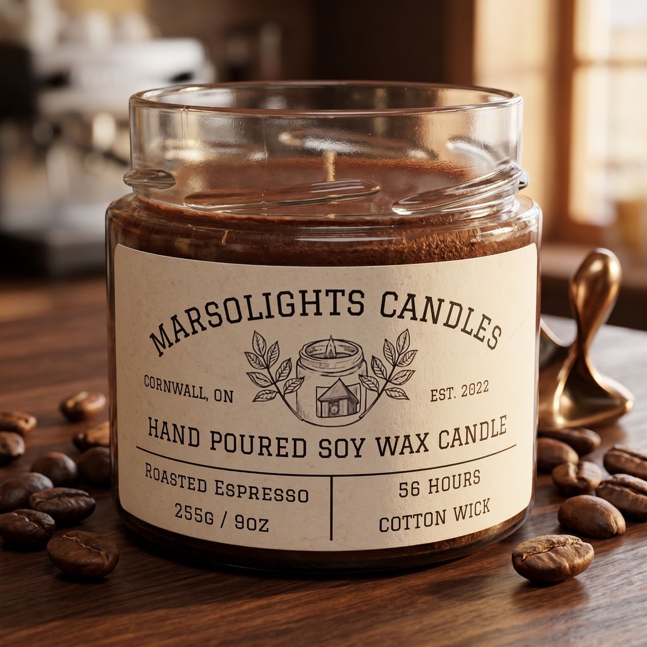 A clear glass soy wax candle jar with a label that reads 'Marsolights Candles, Hand Poured Soy Wax Candle, Roasted Espresso, 255g/9oz, 56 hours'. The jar is placed on a wooden surface with scattered coffee beans around it.