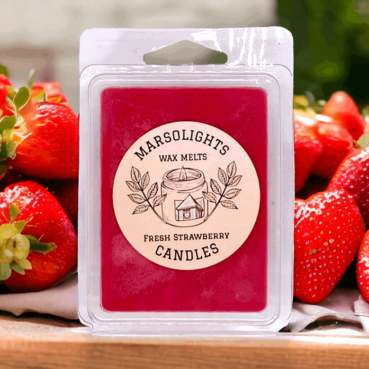 Fresh Strawberry Scented Soy Wax Melt On top of a counter with fresh strawberries 