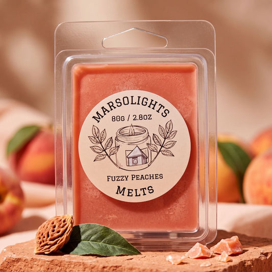 Fuzzy Peaches Wax Melts displayed with peach and candy-inspired décor. The fragrance features ripe peach, red berries and banana peel, with peach blossom and jasmine, finished with apple orchard and soft musk. 80 g or 2.8 oz, approximately 8–10 hours aroma per cube, soy wax, made in Canada, paraben free.