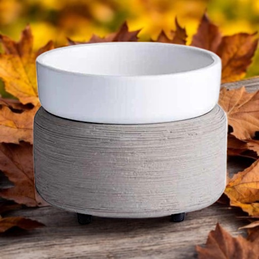 Gray Wax Warmer on Wood with Fall Leaves. 2 in 1 Wax Warmer is concrete grey texture with a white removable dish for candles or use the dish for wax melts.