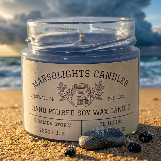 Summer Storm Soy Candle Made in Canada Show on a beach setting with stormy clouds. Fragrance notes as follows 
Top: Mango, Tangerine, Lemon
Mid: Sage, Wormwood
Base: Sandalwood, Patchouli, Tonka Bean
9 ounce or 255 grams 56hour eta burn time. $19.99 CAD