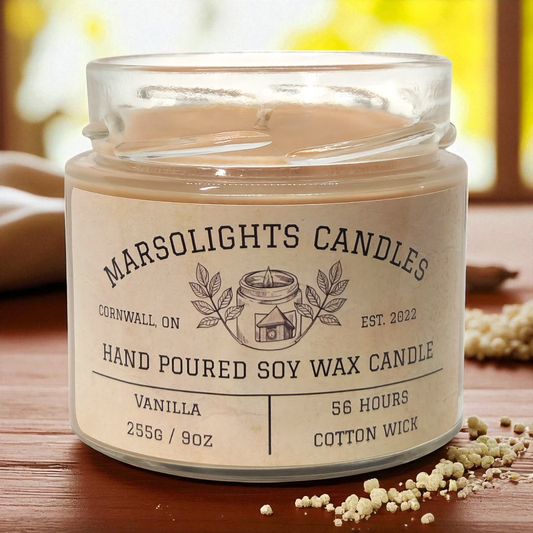 Vanilla candle on a wooden surface with a blurred background and vanilla crunch crystals. 

Fragrance Notes:
Top: Coconut, Vanilla Crunch
Mid: Cinnamon, Honeyed Soft Butter
Base: Cassia Root, Vanilla Sugar, Tonka Bean
Size: 255 grams or 9 ounces
Burn time: 56 Hours
Paraben Free