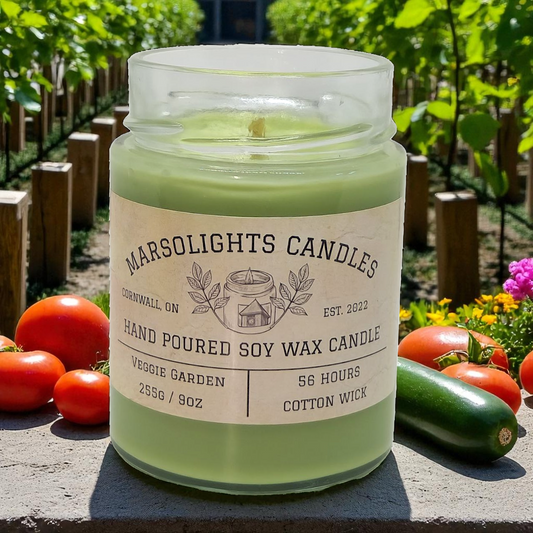 Veggie Garden 9 ounce  soy candle, surrounded by vegetables and plants outdoors.

Candle Size: 255g
Burn time: 56 Hours
Wick type: Cotton
Made in Canada