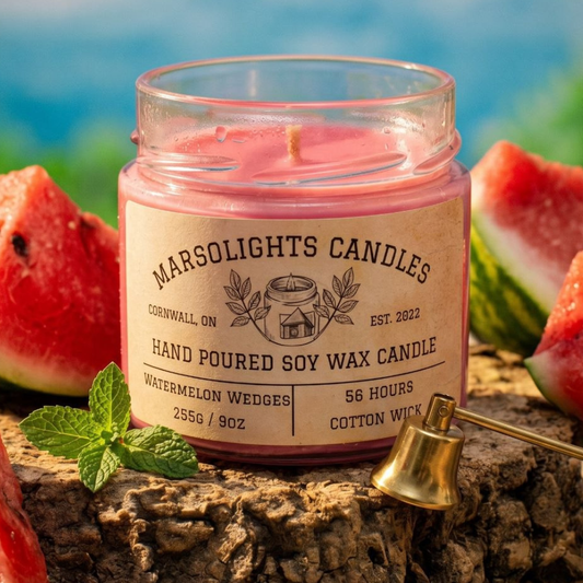 Pink candle in a jar with 'Marsolights Candles' label, surrounded by watermelon wedges. 9 ounce or 255 gras, 56 hour burn time, cotton wick. Similar smell to juicy fruit watermelon or hubba bubba watermelon gum. Made in Canada Shipping Available. $19.99 CAD